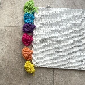 Pom Pom floor mat. NWOT. Never used. Non smoker home.